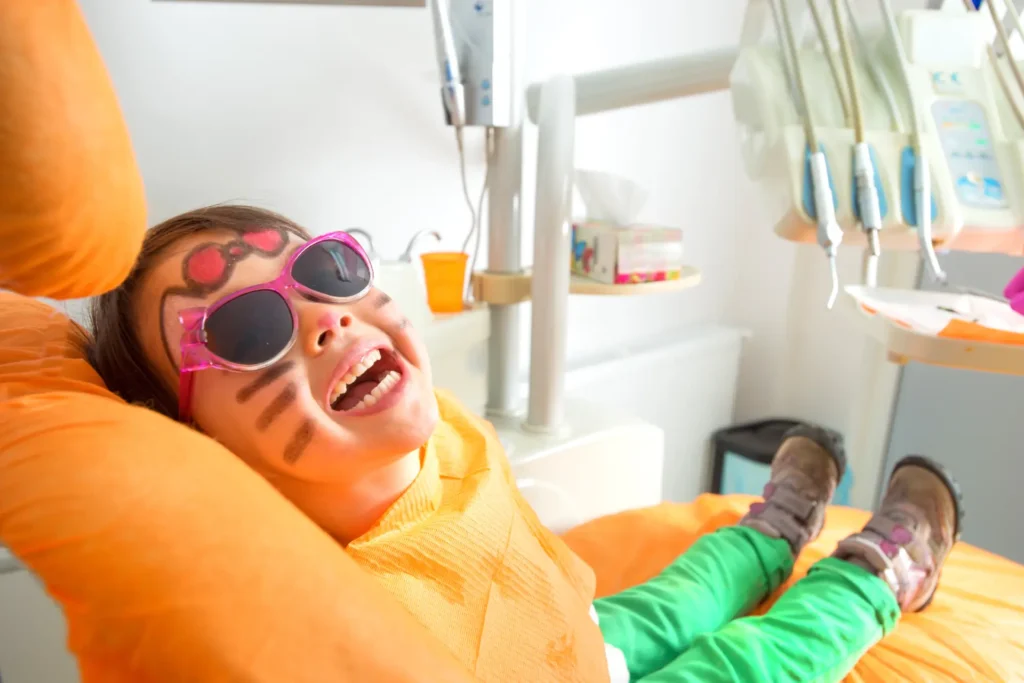 cute girl in a dentist seat